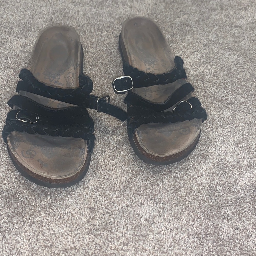 Strapped sandals.